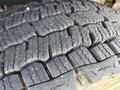 Close-up view of a tire tread from a 1994 Volvo FE 42 showing detailed patterns and grooves designed for traction and stability