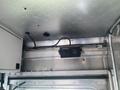 Interior view of a 2007 Morgan Olson Workhorse W42 with visible metal structures and a mounted sound or sensor device along the upper section of the wall