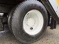 Close-up of a Goodyear G622 PSD tire mounted on a 2016 International 7400 truck with a silver wheel rim and a rugged tread pattern