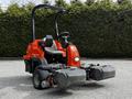 A 2015 Jacobsen Eclipse golf course mower featuring a compact design with a red body and black cutting decks at the front
