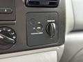 Dashboard controls of a 2007 Ford F-550 featuring switches for airbag and power point