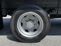 Close-up of a 2018 Hino 195 truck wheel showcasing a silver rim with a black tire featuring tread patterns and the Continental brand name displayed on the side