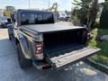 A 2021 Jeep Gladiator with its tailgate open showcasing the truck bed