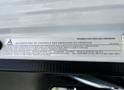 2015 Mitsubishi Fuso FE truck with an emissions control label on its interior dashboard