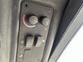 Control panel of a 2014 Toro Groundmaster 5910 featuring knobs for temperature and fan speed along with several toggle switches