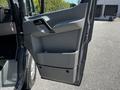A 2017 Mercedes-Benz Sprinter van door with a gray interior panel featuring a handle and lower storage compartment