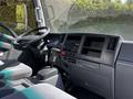 Interior of a 2007 GMC W3500 featuring a steering wheel gear shifter and dashboard controls