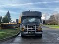 A 2018 Chevrolet Express van with a black exterior and a front-mounted grill guard is parked on a paved surface