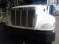 A 2008 Peterbilt PB340 truck showcasing a prominent chrome grille and a solid black front bumper