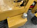 A yellow AGT Industrial KRW23 Mini Loader with visible mechanical components and a metallic cap on the side