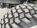 Close-up of a tire from a 2016 New Holland T475 showing a rugged tread pattern designed for traction and durability