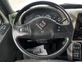 A steering wheel of a 2008 International 7500 truck featuring various controls and a dashboard with multiple gauges and indicators