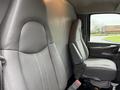 Interior view of a 2009 Chevrolet Express showing two gray fabric seats with a simple design