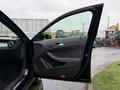A 2016 Mercedes-Benz GLA-250 with the driver's side door ajar showcasing the interior door panel and handle