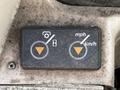 Control panel featuring buttons for speed settings in mph and km/h with indicators for gear and engine hour meter