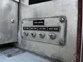 Close-up of a control panel on a 2006 Emergency One Fire Truck featuring four switches labeled for scene lighting with left front right front left rear and right rear settings