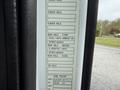 A label on a 2012 Volvo VNL displaying axle specifications including rear axle details and cab paint information