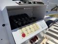 A control panel with labeled switches and levers for operating a 2009 Kenworth T270 vehicle's aerial lift system