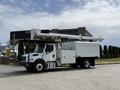 A 2020 Freightliner M2 bucket truck with a white body and extended hydraulic arm ready for use