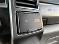 Close-up of the dashboard panel in a 2021 Ford F-550 featuring a power outlet labeled with voltage and wattage specifications