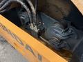 Close-up of the hydraulic system of a 2020 Hyundai HR110C including hoses and mechanical components
