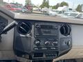 Dashboard of a 2008 Ford F-450 SD showing the radio controls air vents and various knobs for climate and accessory settings