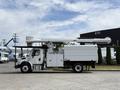 A white 2020 Freightliner M2 bucket truck with an extended aerial lift on the roof and a storage compartment on the side