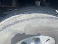 A close-up of a tire on a 2008 Peterbilt 340 showing its tread pattern and wear