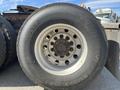 Close-up of a Michelin tire mounted on a 2022 Freightliner Cascadia with visible tread pattern and brand markings