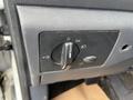 Control panel for lights in a 2010 Ford Transit Connect featuring a dial and switch for various light settings