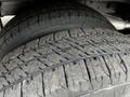 Close-up view of two heavy-duty tires from a 2017 Ford Transit 350 showing tread patterns and detailed rubber texture
