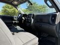Interior view of a 2021 Chevrolet Silverado 1500 showcasing the front seats dashboard and steering wheel