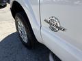 A 2014 Ford F-250 SD with a chrome emblem that reads 6.7 Power Stroke Turbo Diesel on the side near the wheel and tire
