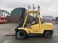 A yellow 2000 Hyster 120 forklift with a lifting mast and forks visible, positioned for operation