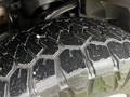 Close-up of a rugged tire tread on a 2017 Ford F-150 showcasing deep grooves and textured patterns designed for traction and durability