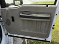 A close-up view of the interior door panel of a 2008 Ford F-550 featuring a handle and textured surfaces
