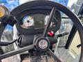 View of the steering wheel and control panel of a 2016 New Holland T475 tractor featuring gauges and controls for operation