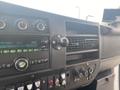 Interior dashboard of a 2016 Chevrolet Express featuring a radio display air vents and various control buttons