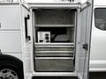 The image shows a storage compartment of a 2019 Ford F-350 SD with shelves and drawers organized for tool and equipment storage