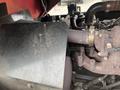 Close-up of the engine compartment of a 2012 Toro Groundsmaster 5910 showing the exhaust manifold and surrounding components