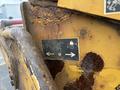 A close-up of a rusted control panel on a 2015 Vermeer Corporation BC1200XL featuring worn graphics and instruction icons for operation