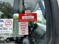 A 2012 Freightliner M2 106 displays a red British Columbia certificate of approval sticker on its windshield with the year 2026 and vehicle identification details