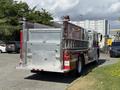 A red and silver 1994 Volvo FE 42 fire truck with a ladder and various compartments visible on the side