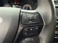 Close-up of the steering wheel controls in a 2019 Ford Explorer featuring buttons for volume navigation and phone functions