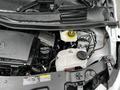 The engine compartment of a 2023 Mercedes-Benz Metris showing the engine, coolant reservoir, and various components with a focus on mechanical parts