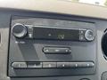 Dashboard of a 2008 Ford F-450 SD featuring a radio with AM FM options and a digital display showing a time of 42