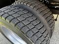 Close-up of a tire from a 2021 Ford F-550 showcasing its tread pattern and rubber texture