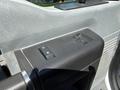 The interior control panel of a 2012 Ford F-450 SD featuring buttons for window controls and locking mechanisms