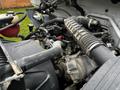Close-up of the engine compartment of a 2013 Ford F-650 showing various engine components and hoses