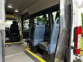 Interior view of a 2016 RAM Promaster showing two blue seats positioned in the back with a step leading up to them